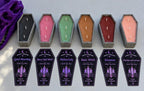 Six coffin-shaped candles labeled Good Mourning, Berry Bad Witch, Meloncholy, Basic Witch, Sinamon, and Peaches and Scream