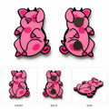 Pink pig magnet shown from the front, back, and side